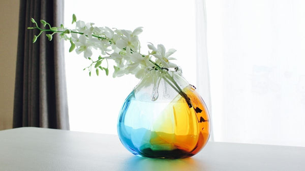 Beautiful vase with melting glass color and transparency
