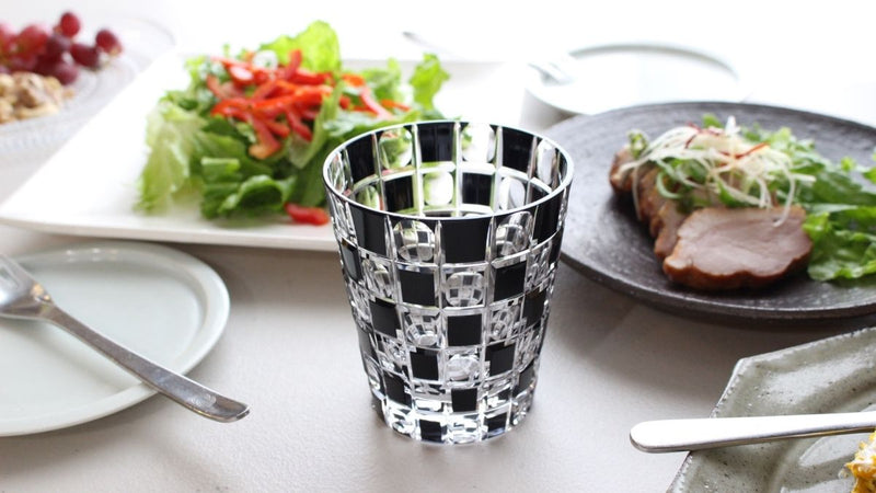 Modern and stylish faceted old glass with black checkerboard pattern