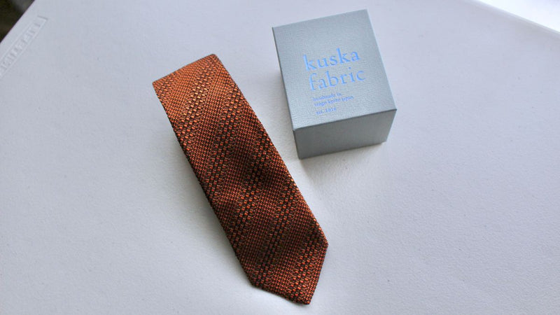 Highly sophisticated neckties with a unique hand-woven and hand-stitched texture