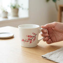 [MUG (CUP)] CHERRY BLOSSOMS (WHITE) | COLOR & DESIGN CHANGE | MINO WARES | MARUMO TAKAGI｜使用イメージ（演出・手持ち）※手作りのため色・風合いは一点ごとに異なります
