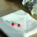 Clip-on earrings for both ears.