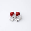 Clip-on earrings for both ears.