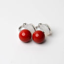 Clip-on earrings for both ears.